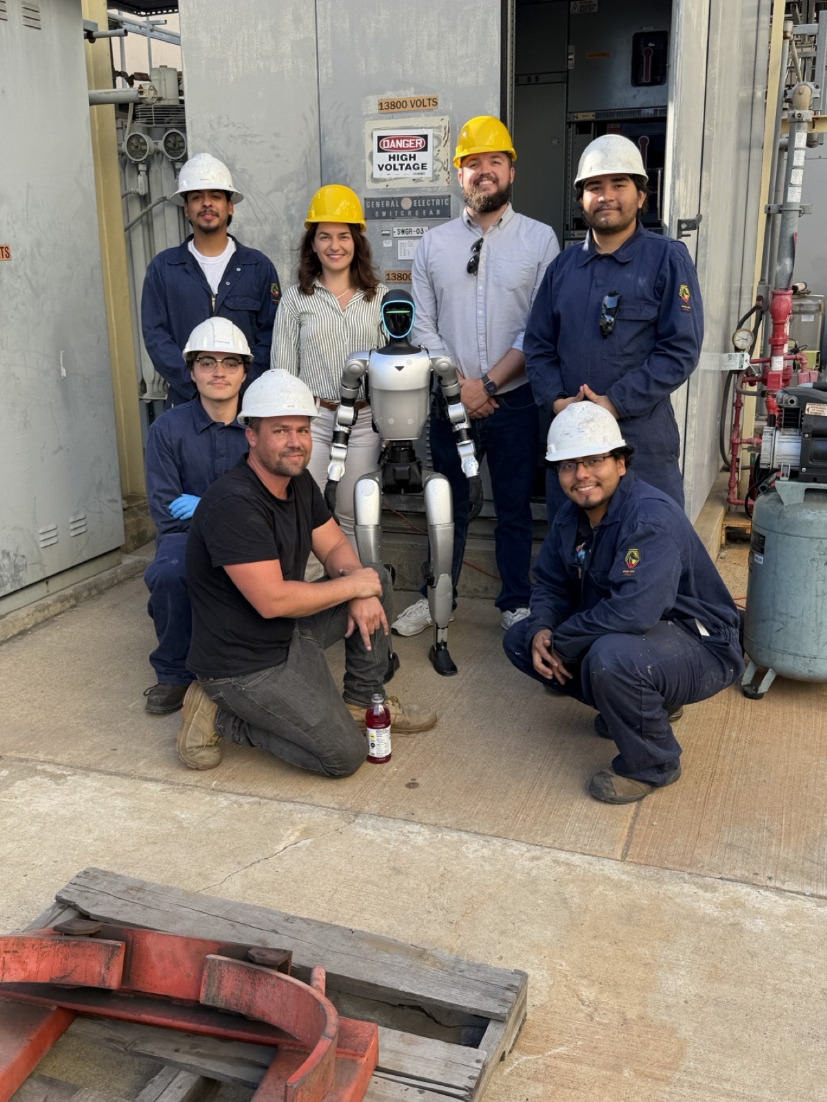 The team on site with the humanoid robot at a power plant