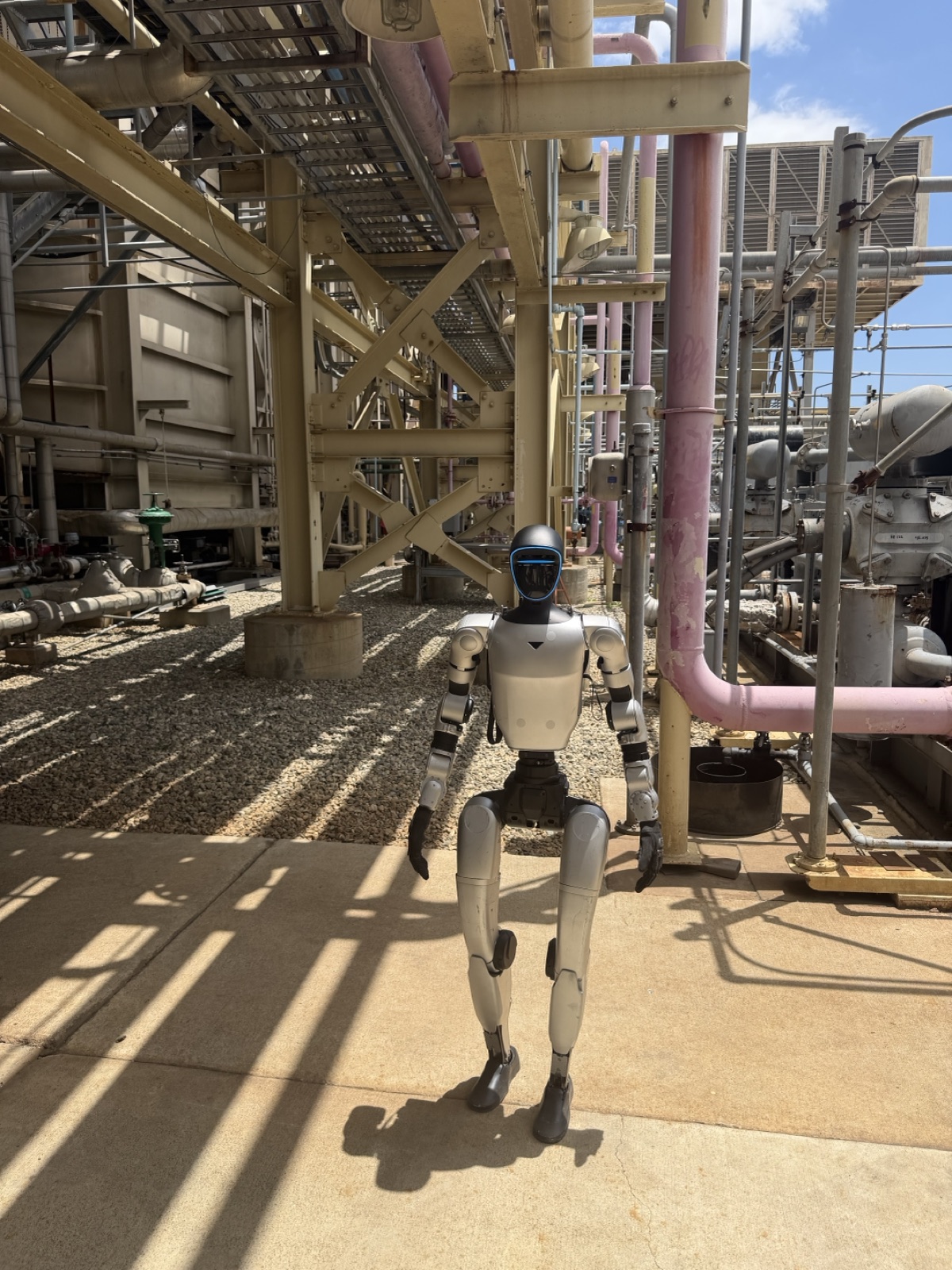 A humanoid robot standing on station in a power plant